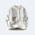 White. A cream-colored knit sweater with a distressed, ripped design showing beige lining.