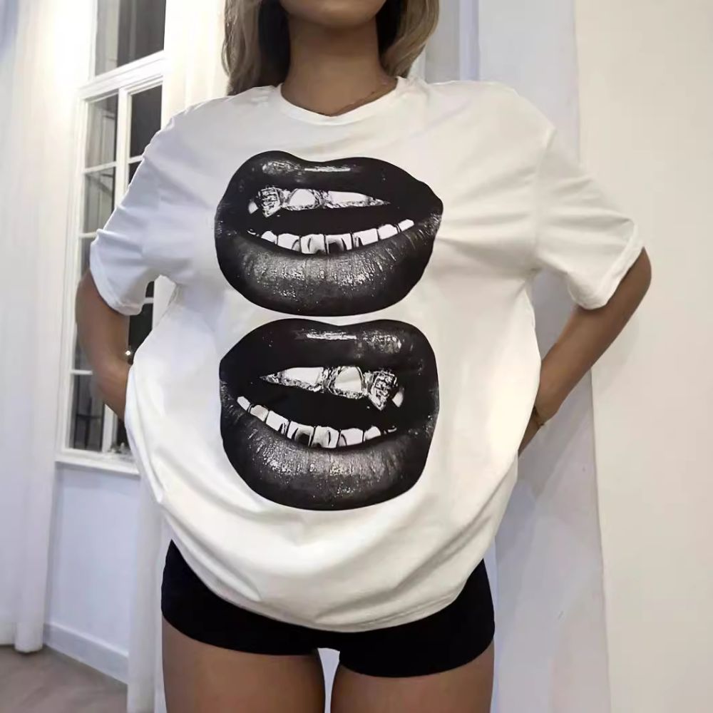 Person wearing a white t-shirt with black lips graphic design.
