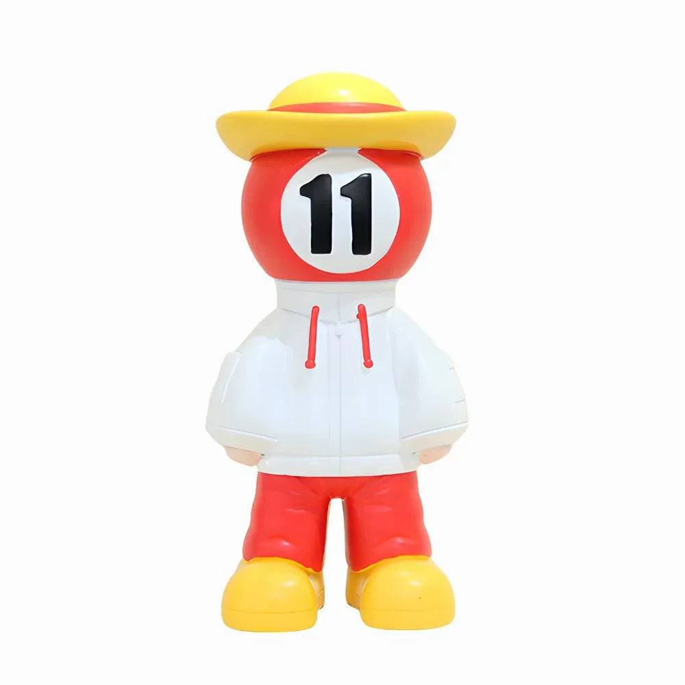 Toy figure with a yellow hat, red outfit, and number 11 on a white background