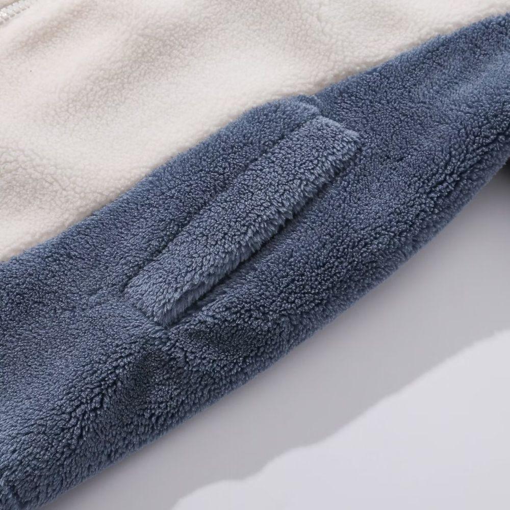 Close-up of a blue textured blanket on a light background