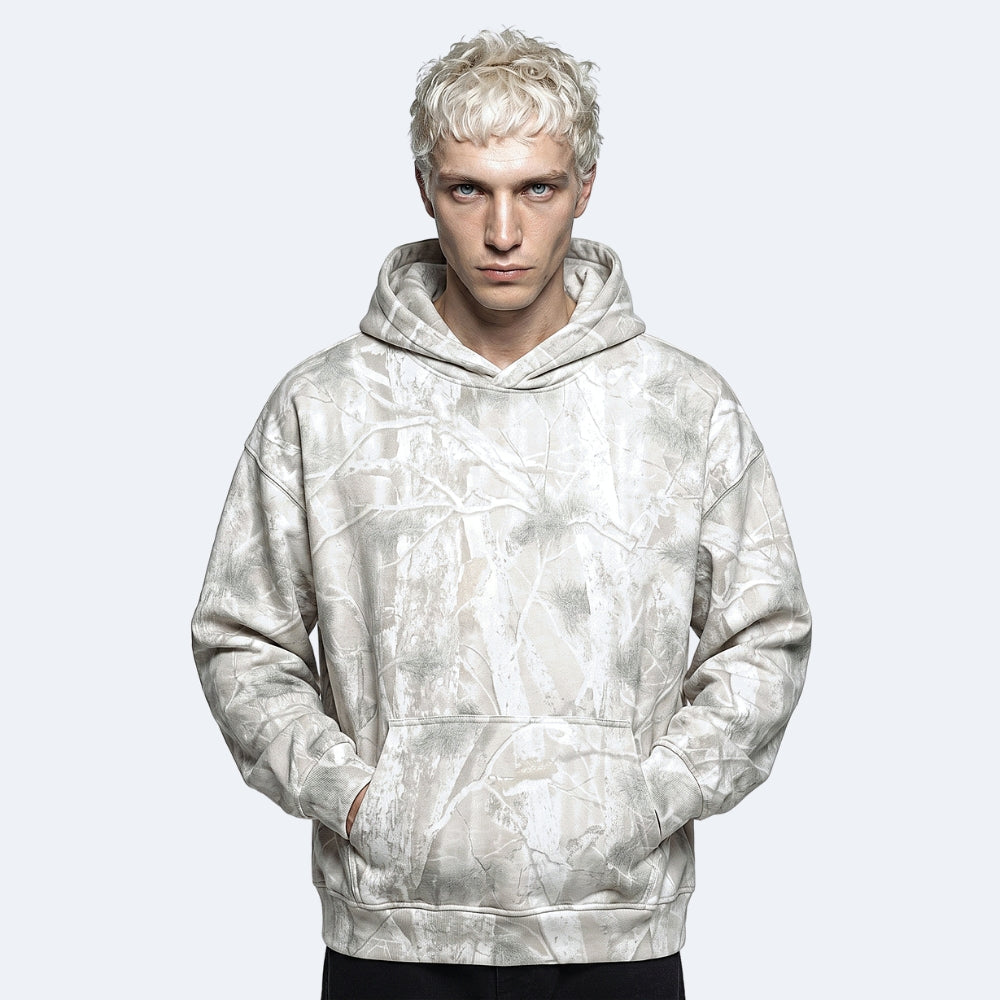 Veins. A model with platinum blonde hair wearing a light gray and white marbled hoodie.