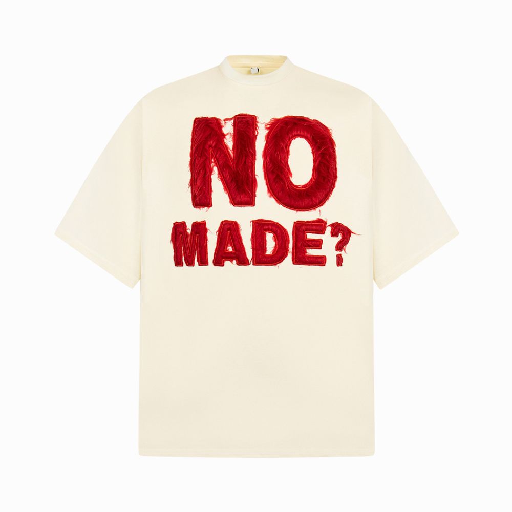 Beige t-shirt with red text 'NO MADE?' on a white background