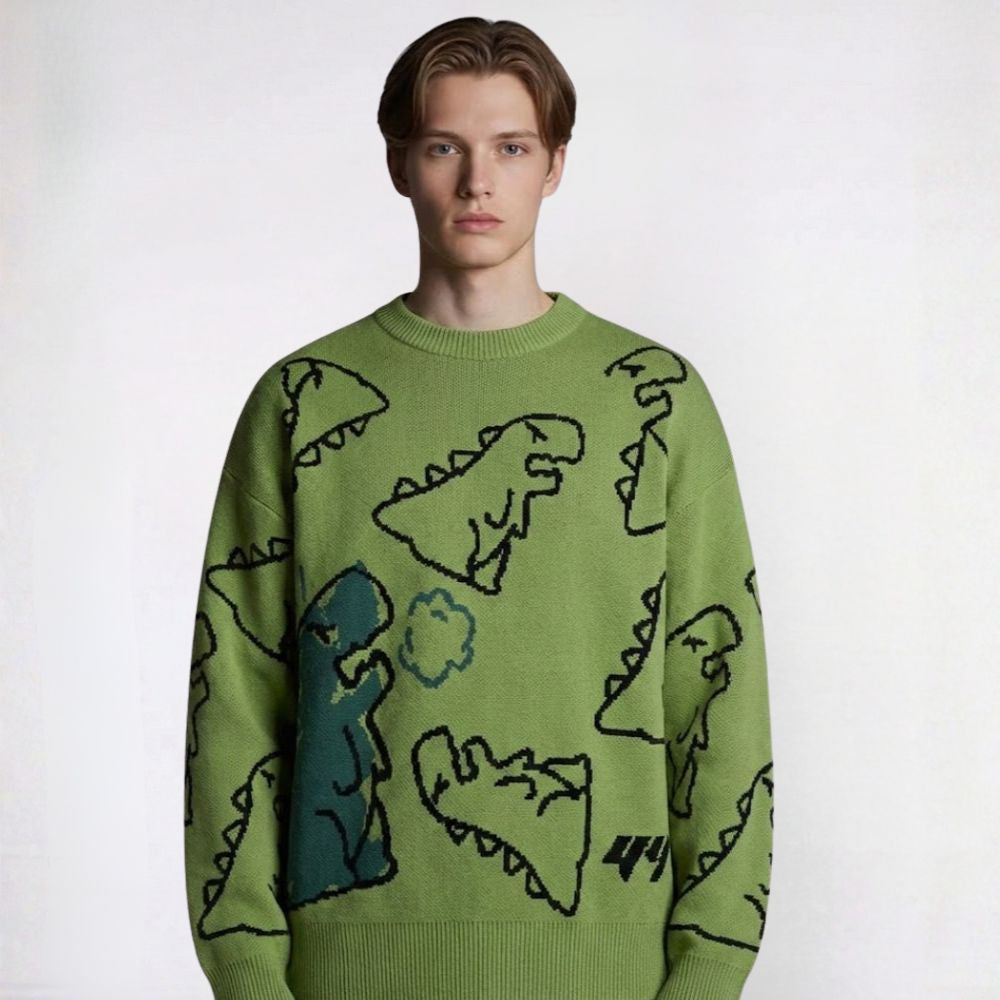 Person wearing a green sweater with dinosaur patterns on a white background