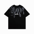 Black t-shirt with gray graphic design on a white background
