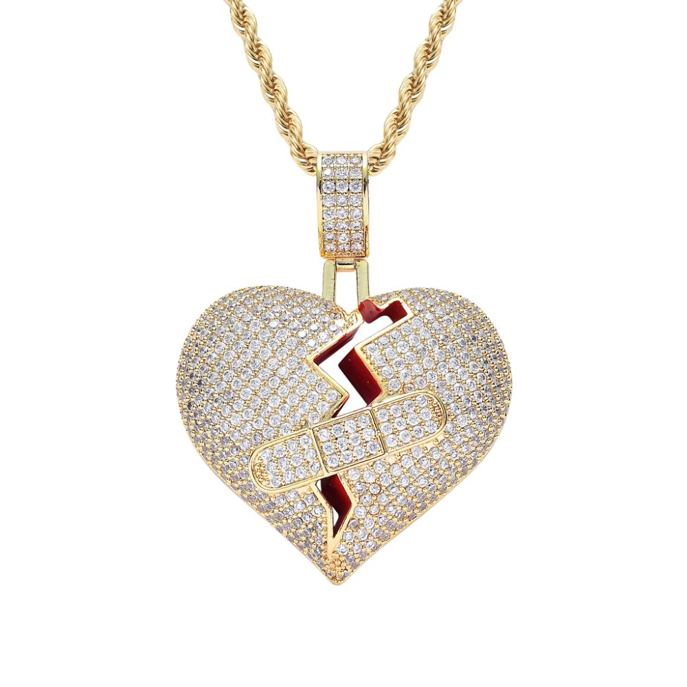 Heart-shaped pendant with lightning bolt design on a gold chain against a white background