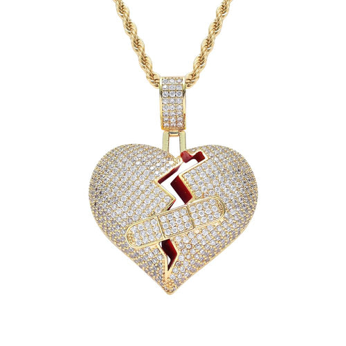 Heart-shaped pendant with lightning bolt design on a gold chain against a white background