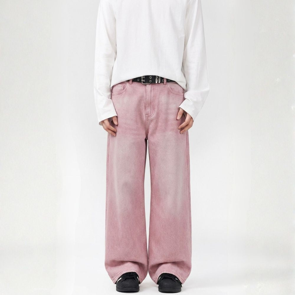 Person wearing a white long-sleeve shirt and pink wide-leg pants on a white background