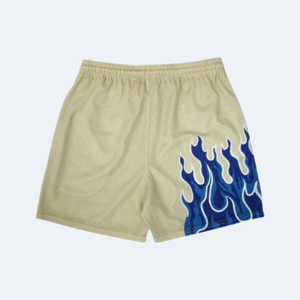 Beige. Beige mesh athletic shorts with a blue and white flame graphic on the lower right leg.