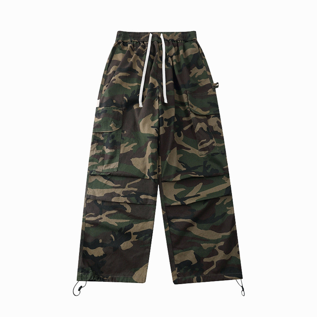 Camouflage pants with multiple pockets on a white background