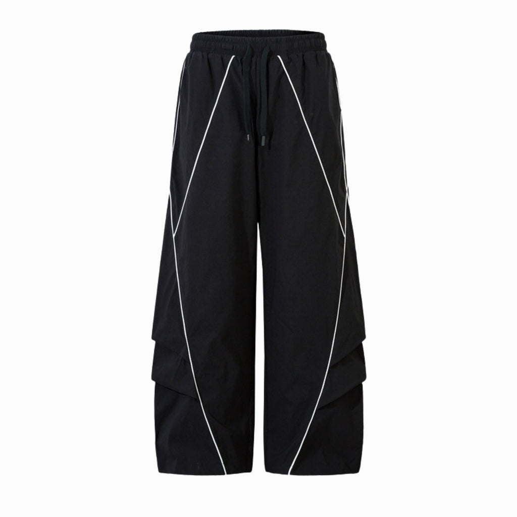 Black wide-leg pants with white piping on a white background