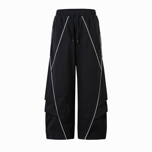 Black wide-leg pants with white piping on a white background