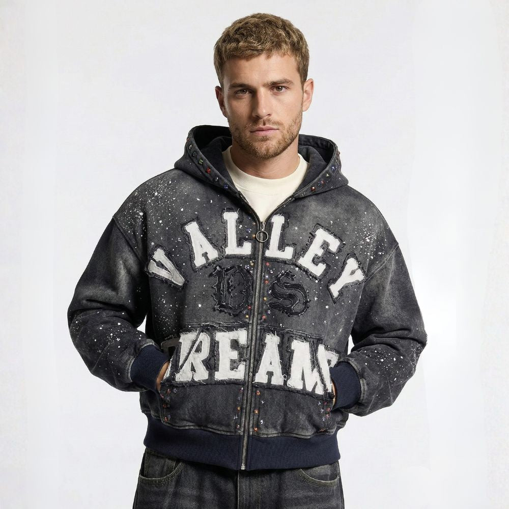 Man wearing a gray hoodie with 'Valley Dreams' text on a white background
