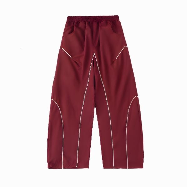 Maroon pants with white stitching on a white background