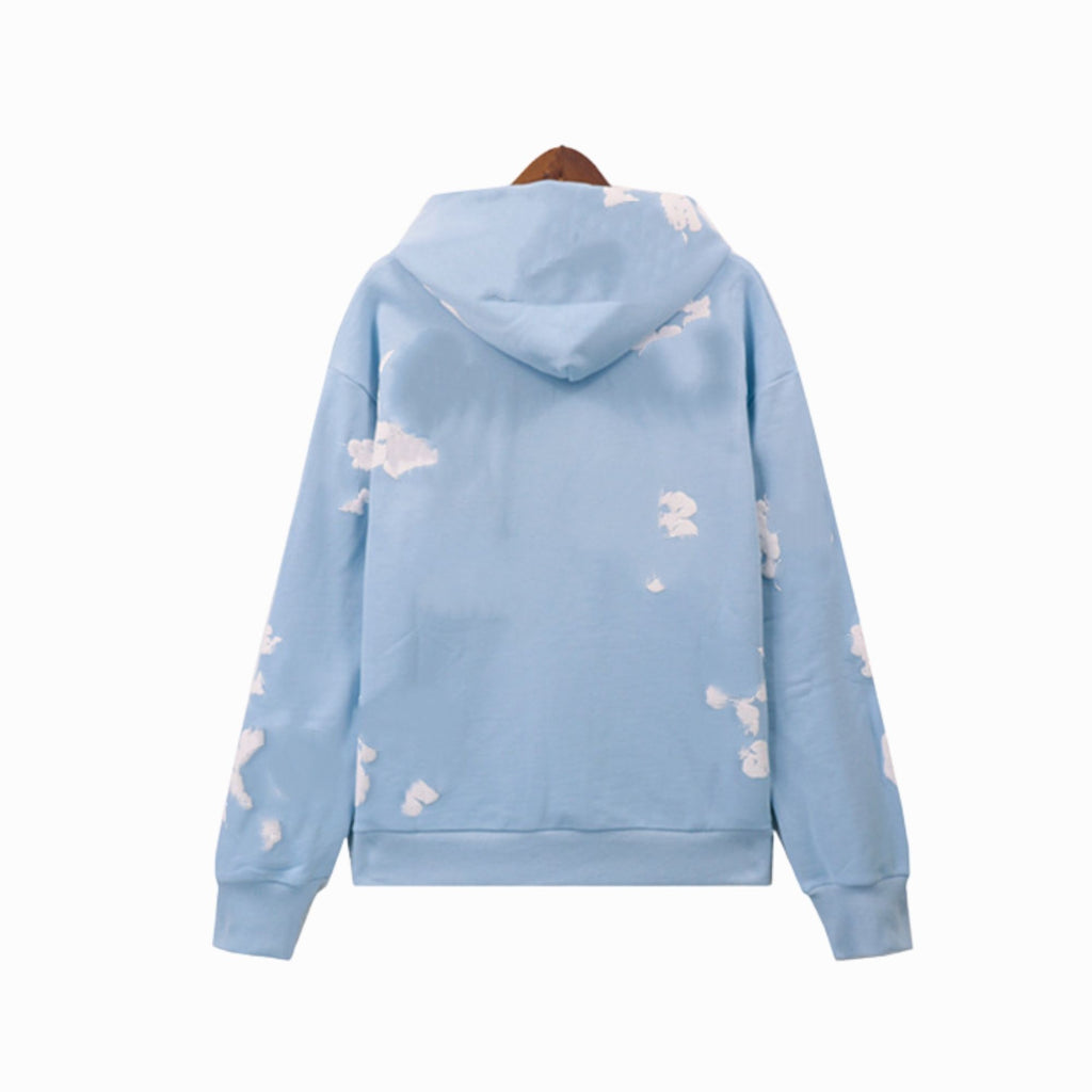 Light blue hoodie with cloud patterns on a white background