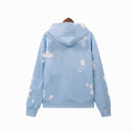 Light blue hoodie with cloud patterns on a white background