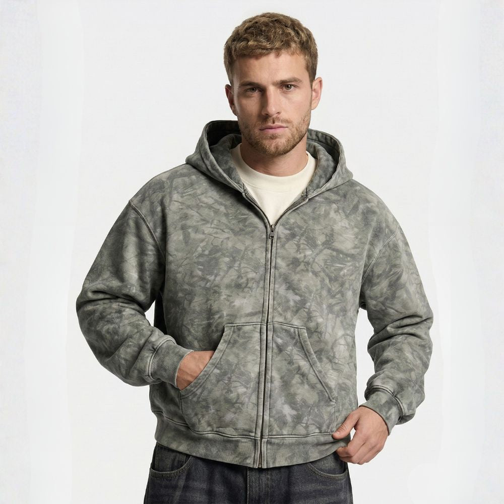 Man wearing a gray hooded jacket on a white background