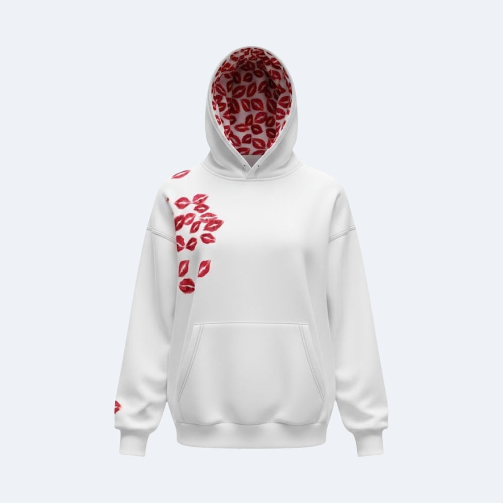 A white pullover hoodie with a red lip print pattern. The hood lining and the left shoulder/chest area feature a repeating pattern of red lips, and there is a small red lip detail on the right sleeve cuff.