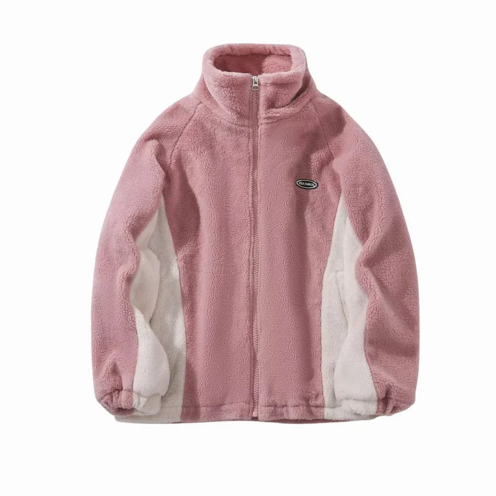 Pink fleece jacket with white accents on a white background