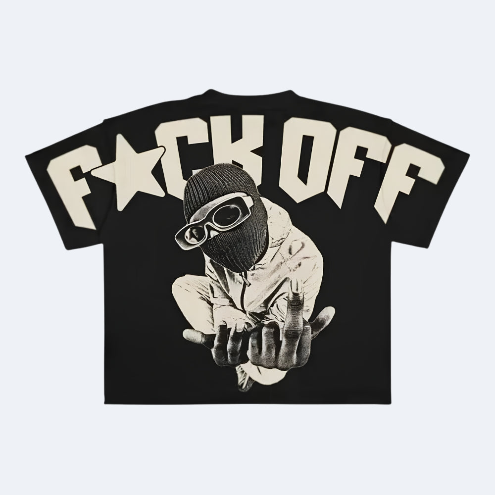 A black short-sleeve graphic t-shirt featuring the text 'F*CK OFF' in a bold cream-colored font across the chest, with a central graphic of a person in a black balaclava and goggles making a hand gesture.