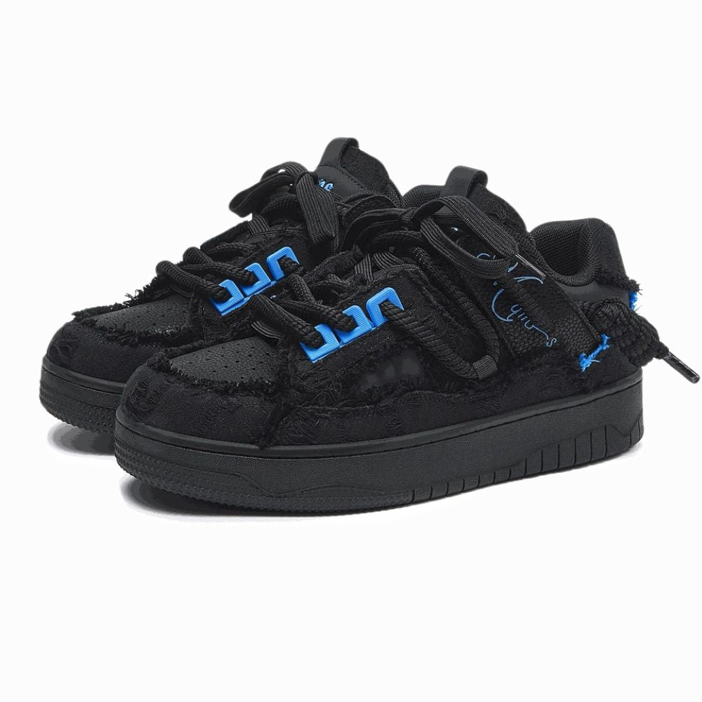 Black sneakers with blue accents on a white background