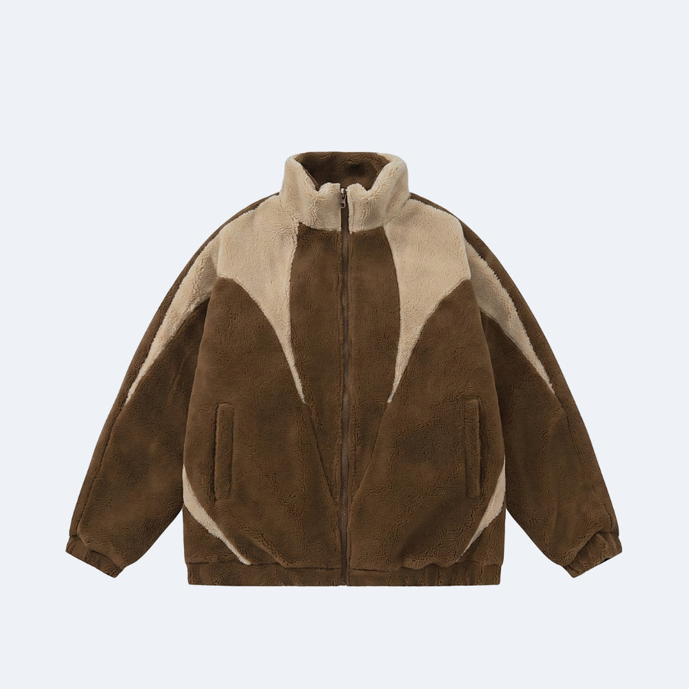 Brown. A brown and beige color-blocked zip-up jacket made of soft suede-like and sherpa-like textures.