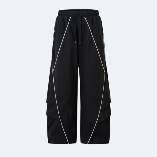 Black wide-leg cargo pants with white geometric piping details and a drawstring waist, shown against a light gray background.