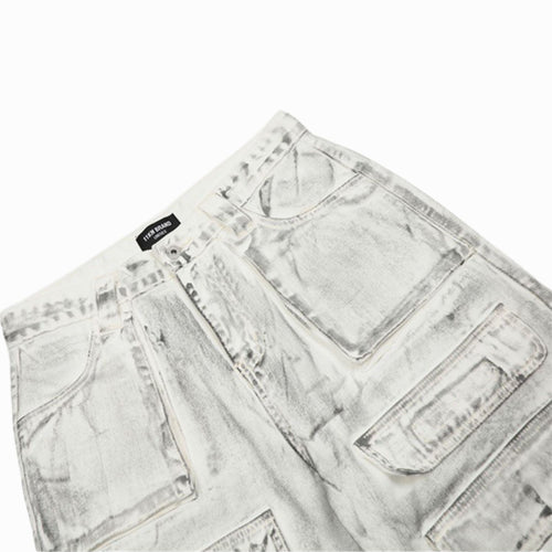 White acid-wash jeans with a brand label on a white background