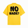 Yellow t-shirt with black text 'NO MADE?' on a white background