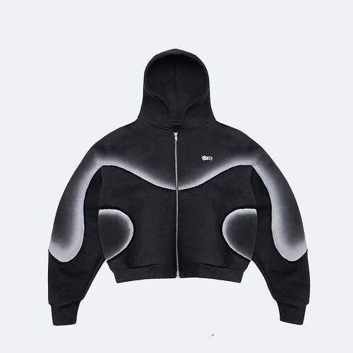 A black cropped zip-up hoodie with a white-to-gray gradient abstract graphic pattern across the shoulders, sleeves, and lower torso, featuring a small white 'GK' logo on the left chest, shown against a light gray background.