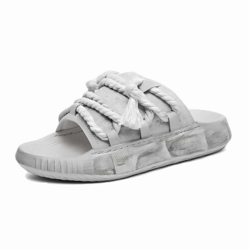 Gray slide sandal with braided design on a white background
