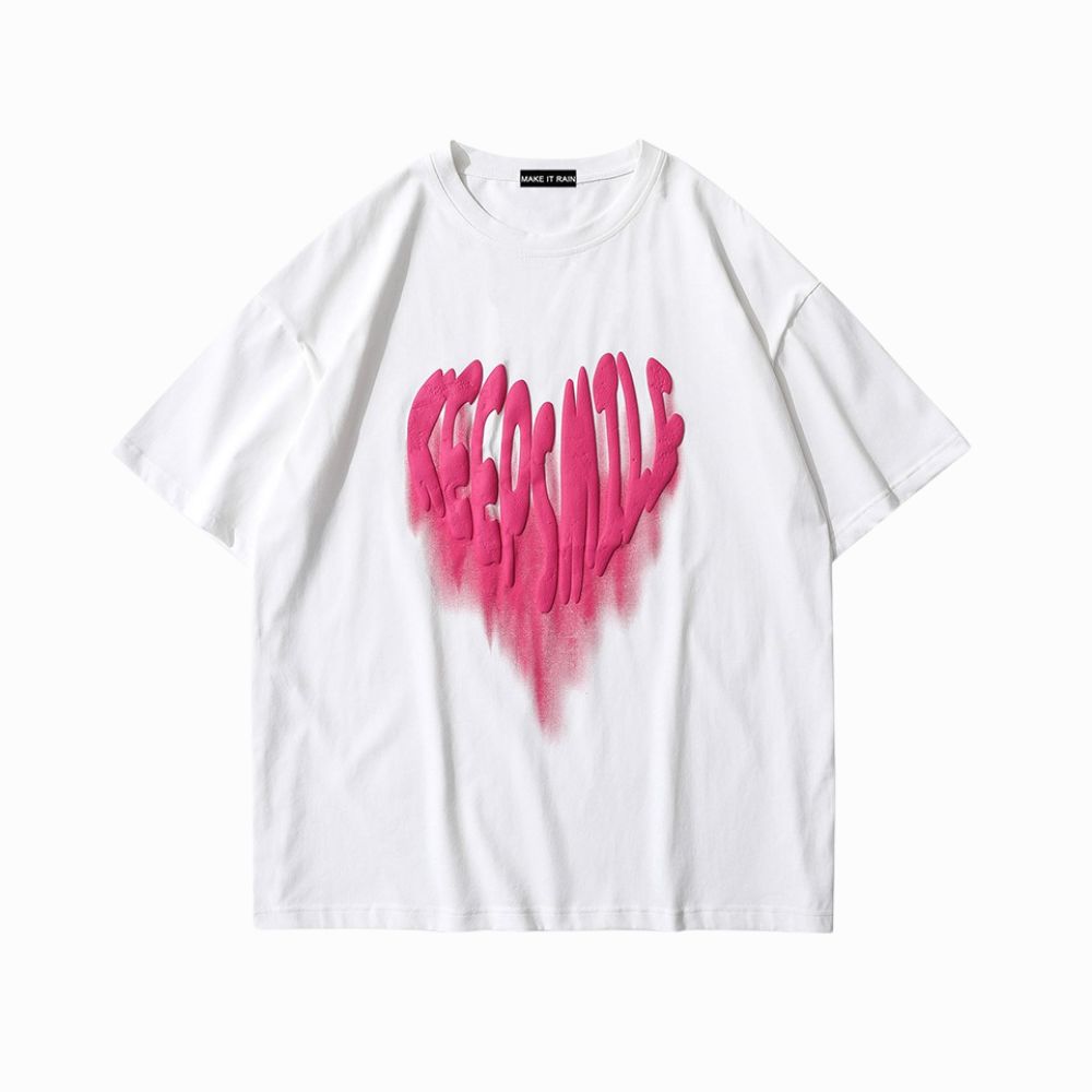 White t-shirt with pink heart-shaped text on a white background