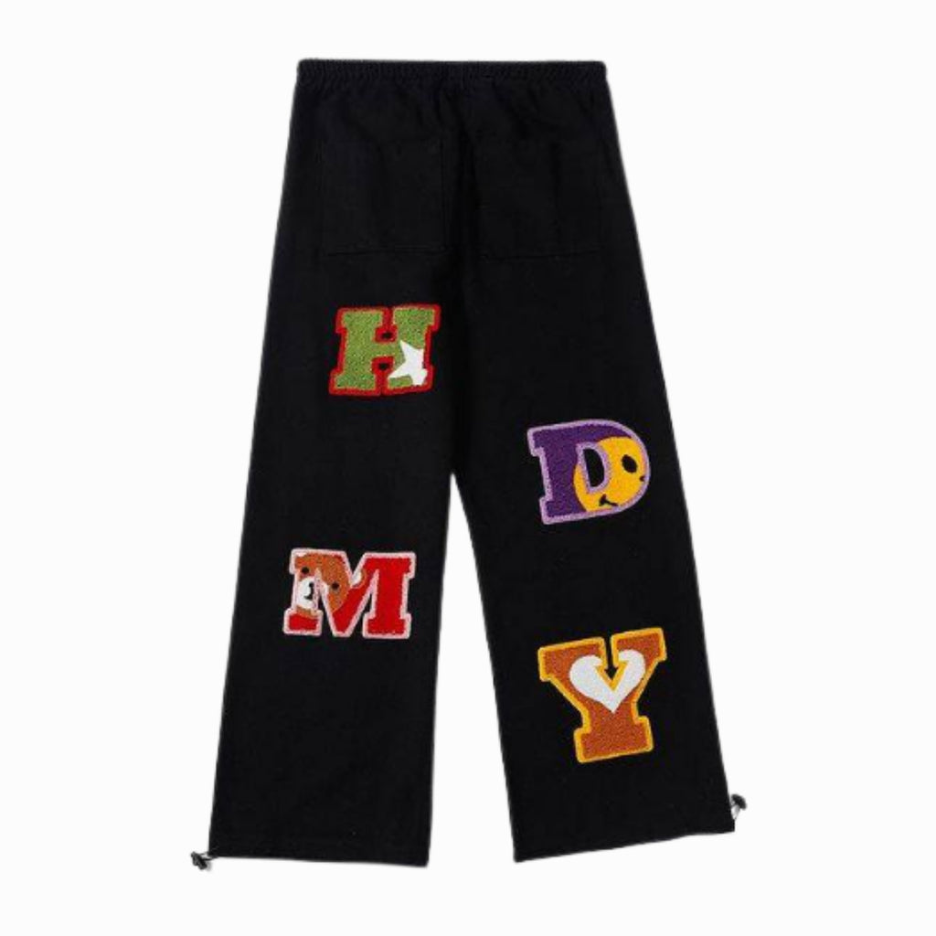 Black pants with colorful letters on a white background