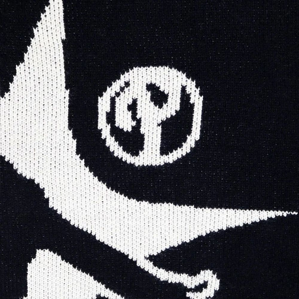 Close-up of a black and white logo on a textured background