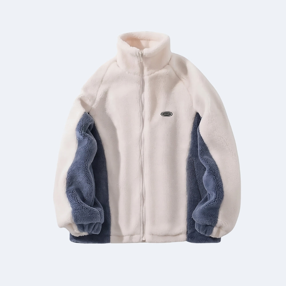 Blue. A fleece zip-up jacket with a cream-colored body and navy blue sleeve panels, featuring a small oval logo on the left chest.