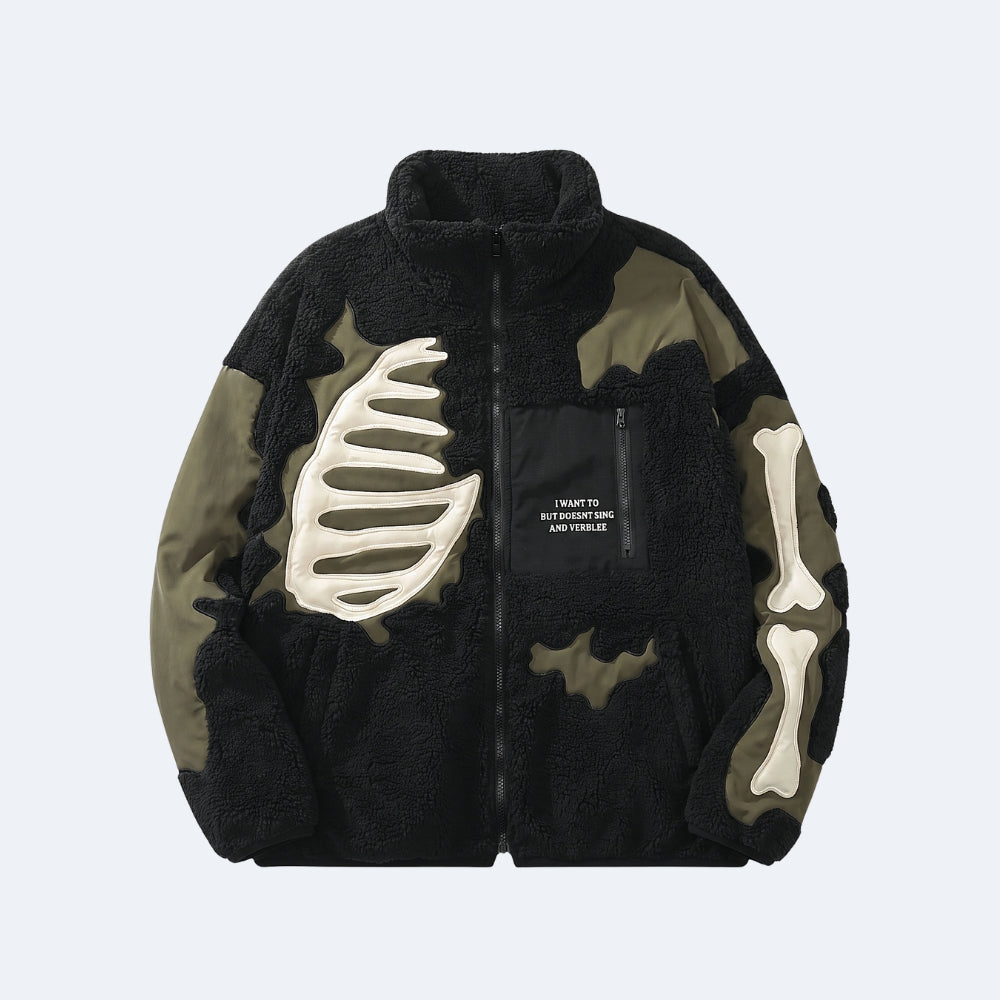 Black. A black and olive green fleece jacket with bone graphic appliqués on the chest and sleeve, and a black chest pocket with white text.