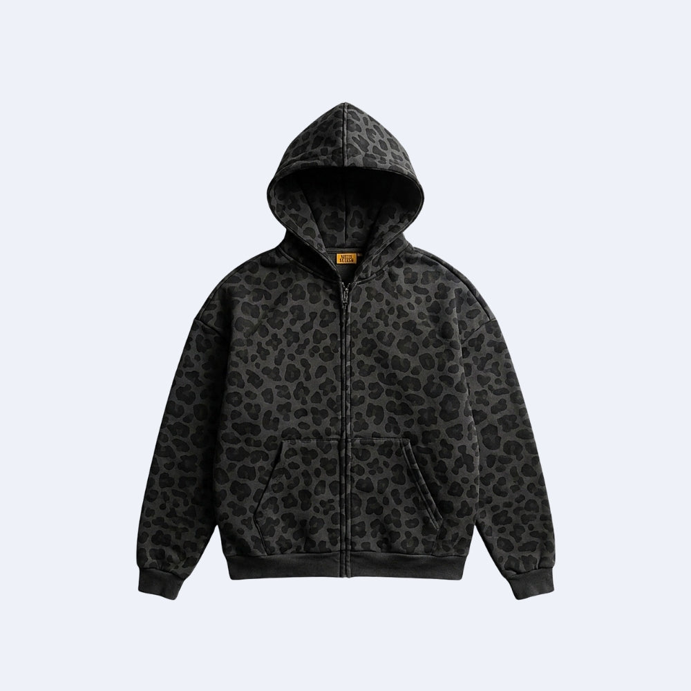 Black. KRUX Feral black leopard-print zip hoodie, flat lay front view with hood up