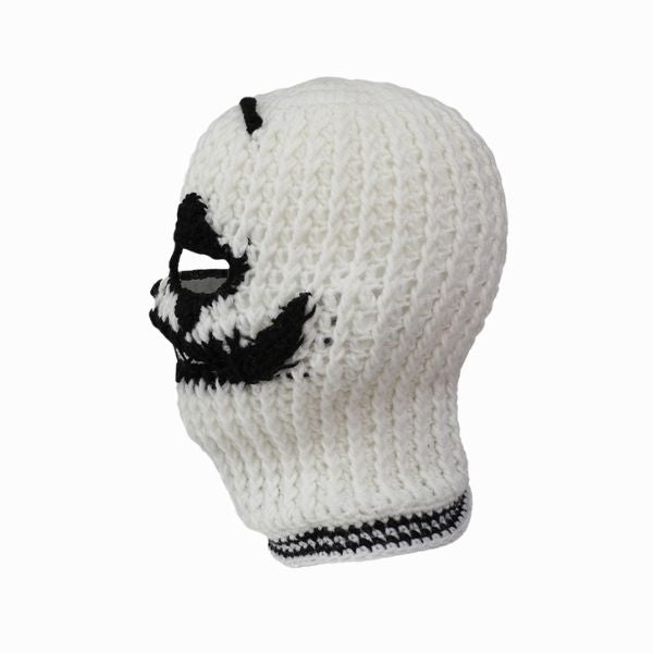 White knit balaclava with black accents on a white background