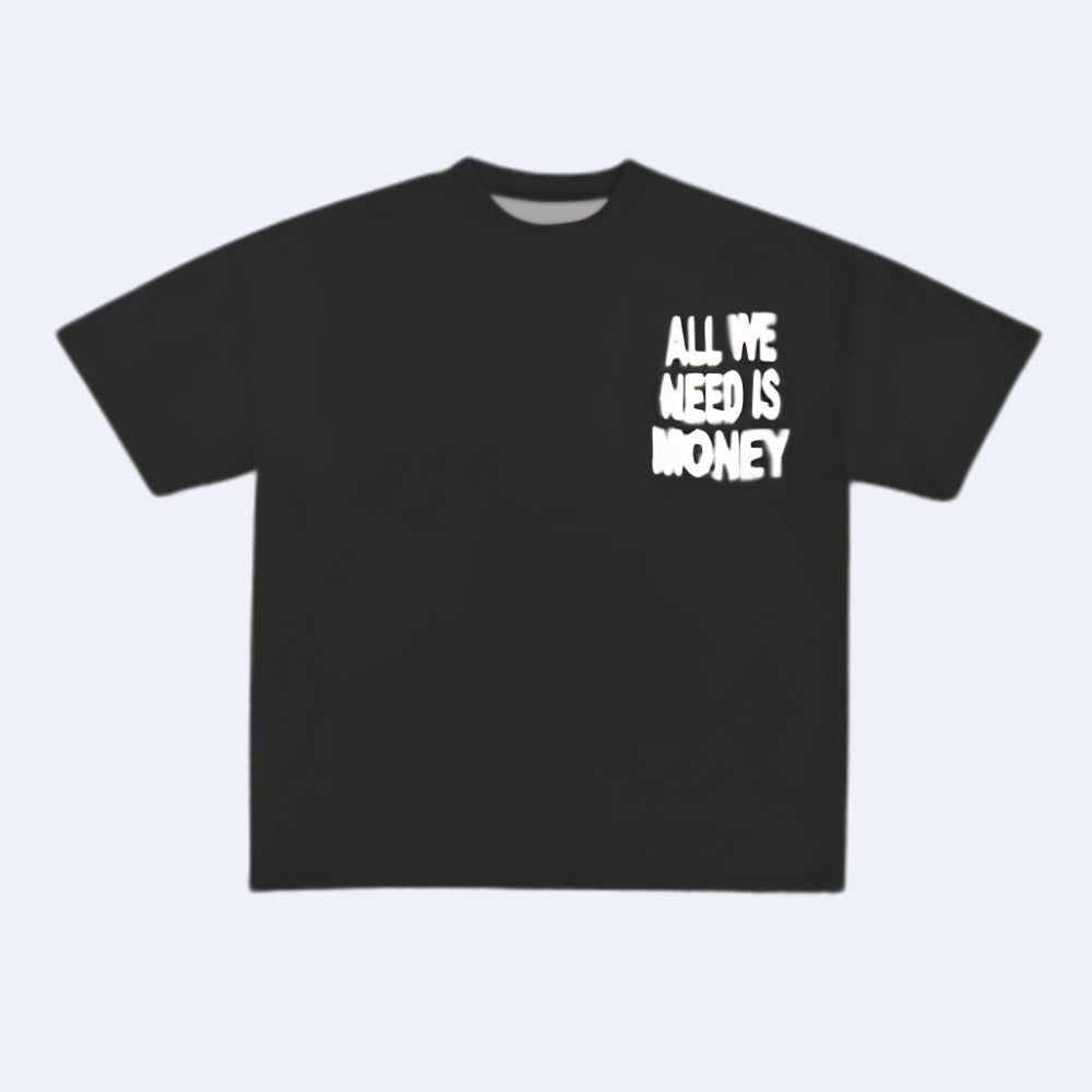 A black short-sleeve t-shirt with the phrase 'ALL WE NEED IS MONEY' printed in a white, distressed font on the left chest, displayed against a light gray background.