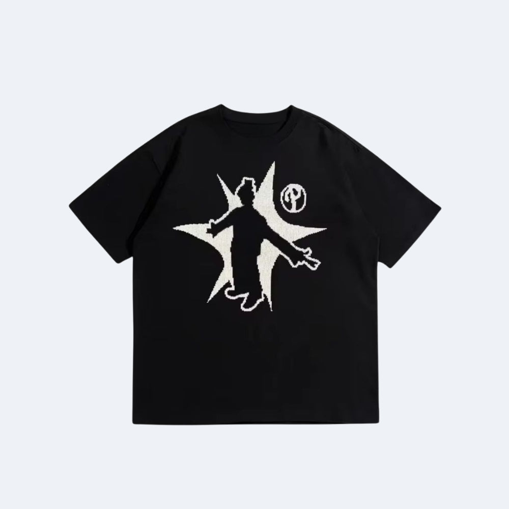 Black. A black short-sleeve crewneck t-shirt featuring a large graphic print with a white silhouette of a figure inside a starburst shape and a small circular logo.