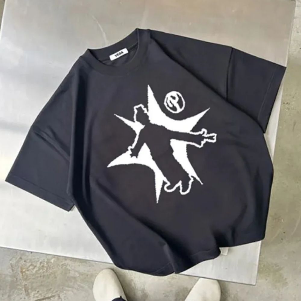 Black t-shirt with white graphic design on a light gray surface