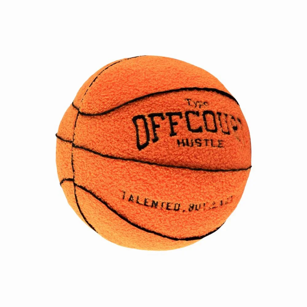 Orange basketball pillow with black text on a white background