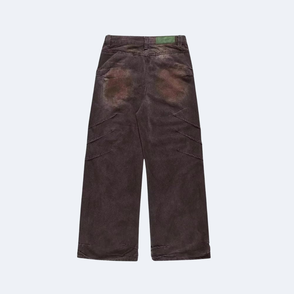A pair of dark brown corduroy pants shown from the back, featuring a green brand label at the waistband, photographed against a light gray background.