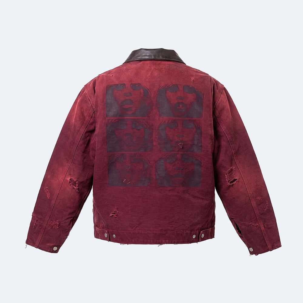 A distressed red denim jacket shown from the back, featuring a dark graphic print of a face in a grid pattern and ripped details on the sleeves and lower back.