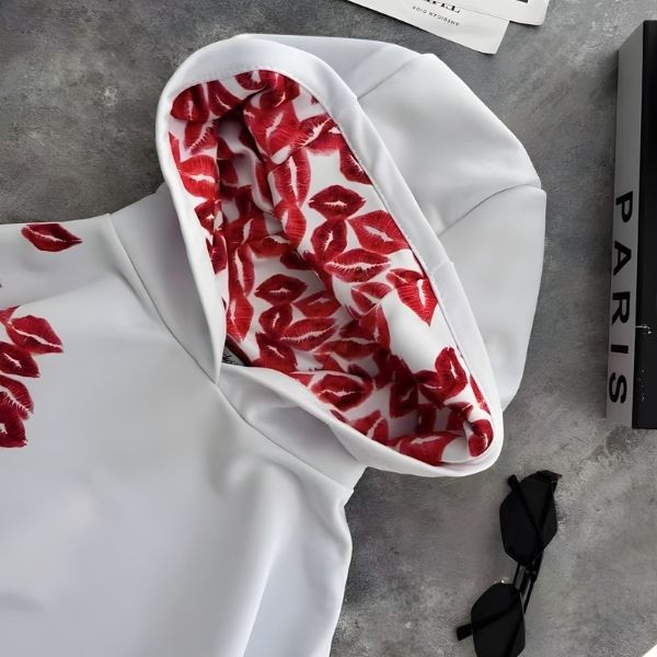 White fabric with red pattern on a gray surface