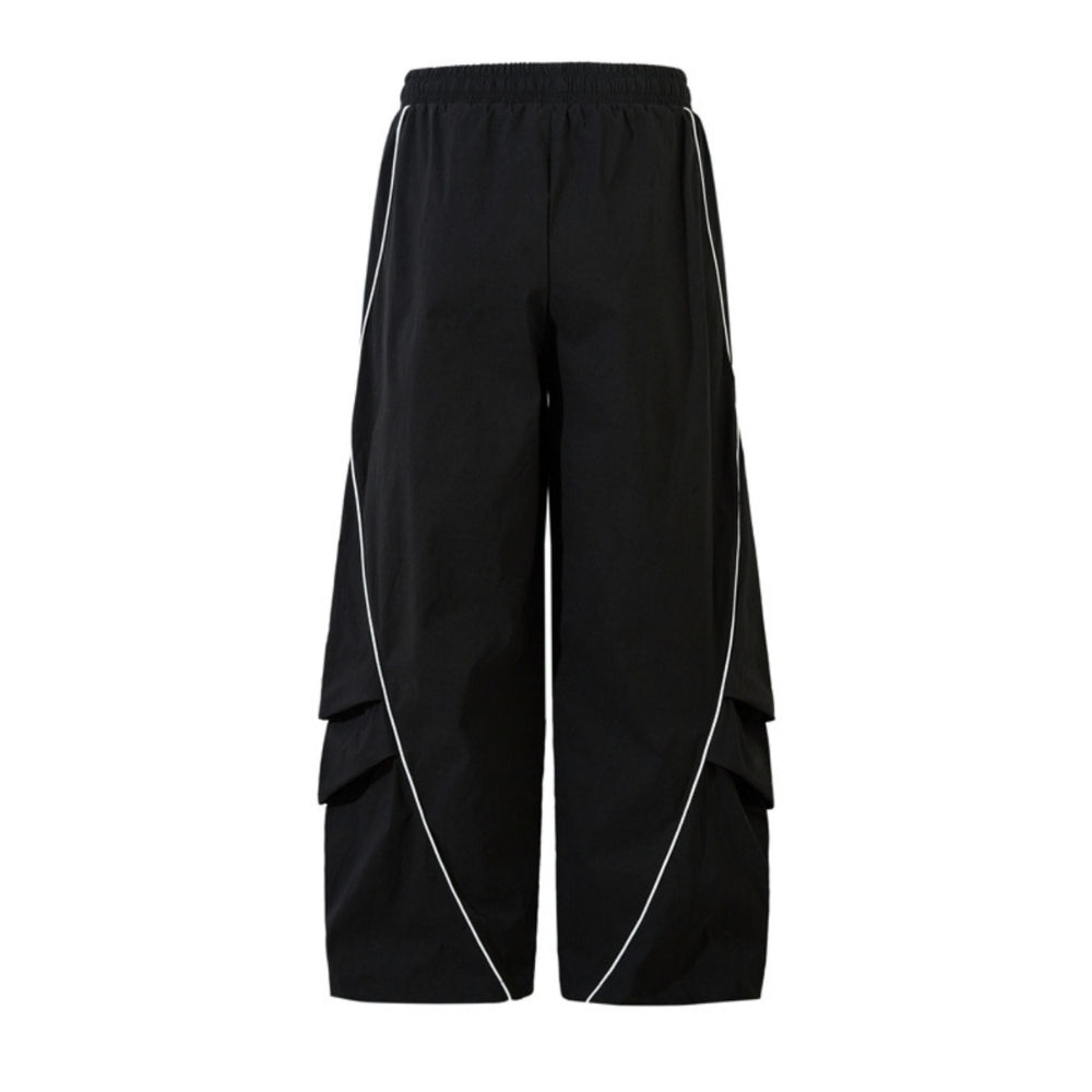 Black wide-leg cargo pants with white piping details running down the sides and between the cargo pockets, shown against a plain white background.