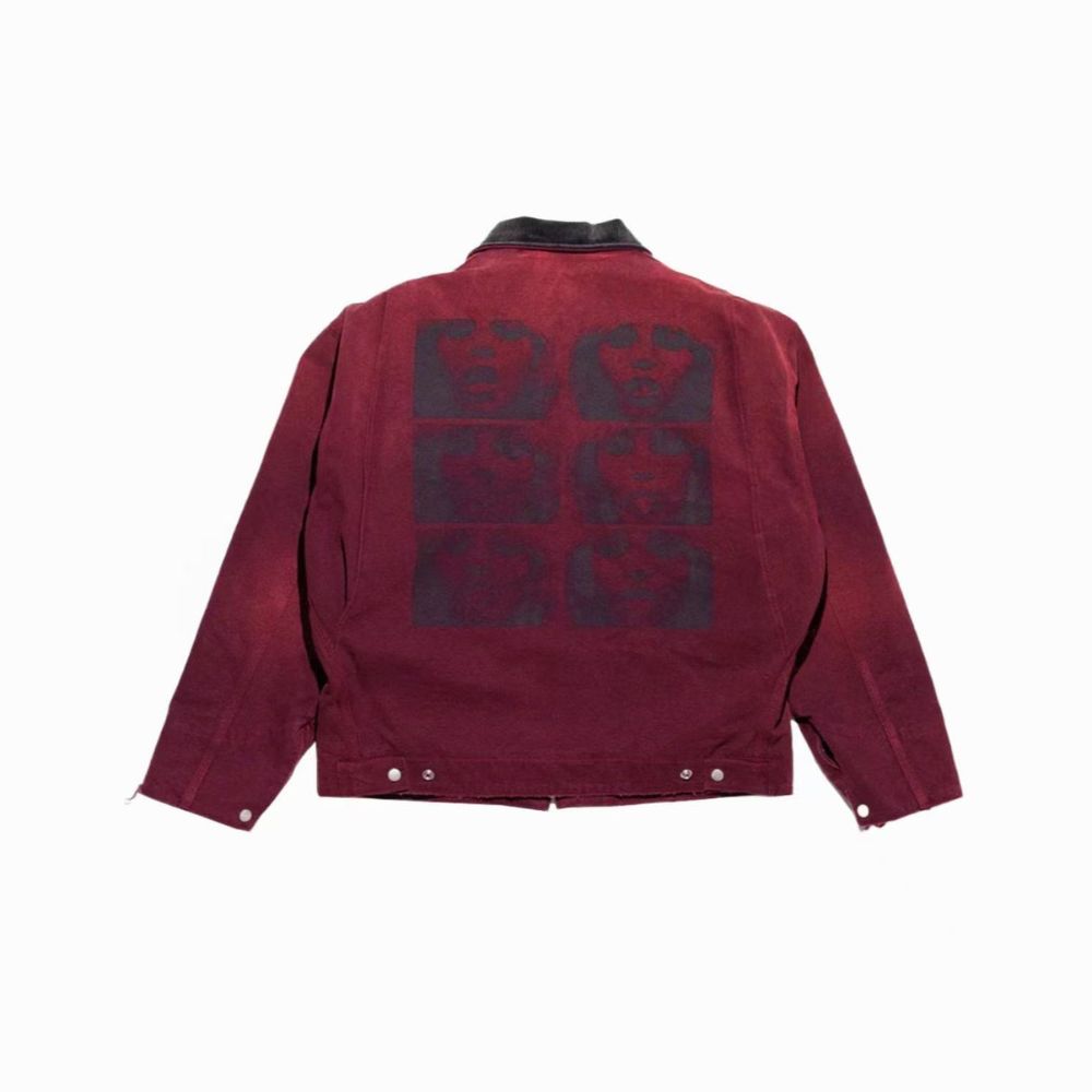 Red jacket with black geometric pattern on the back against a white background