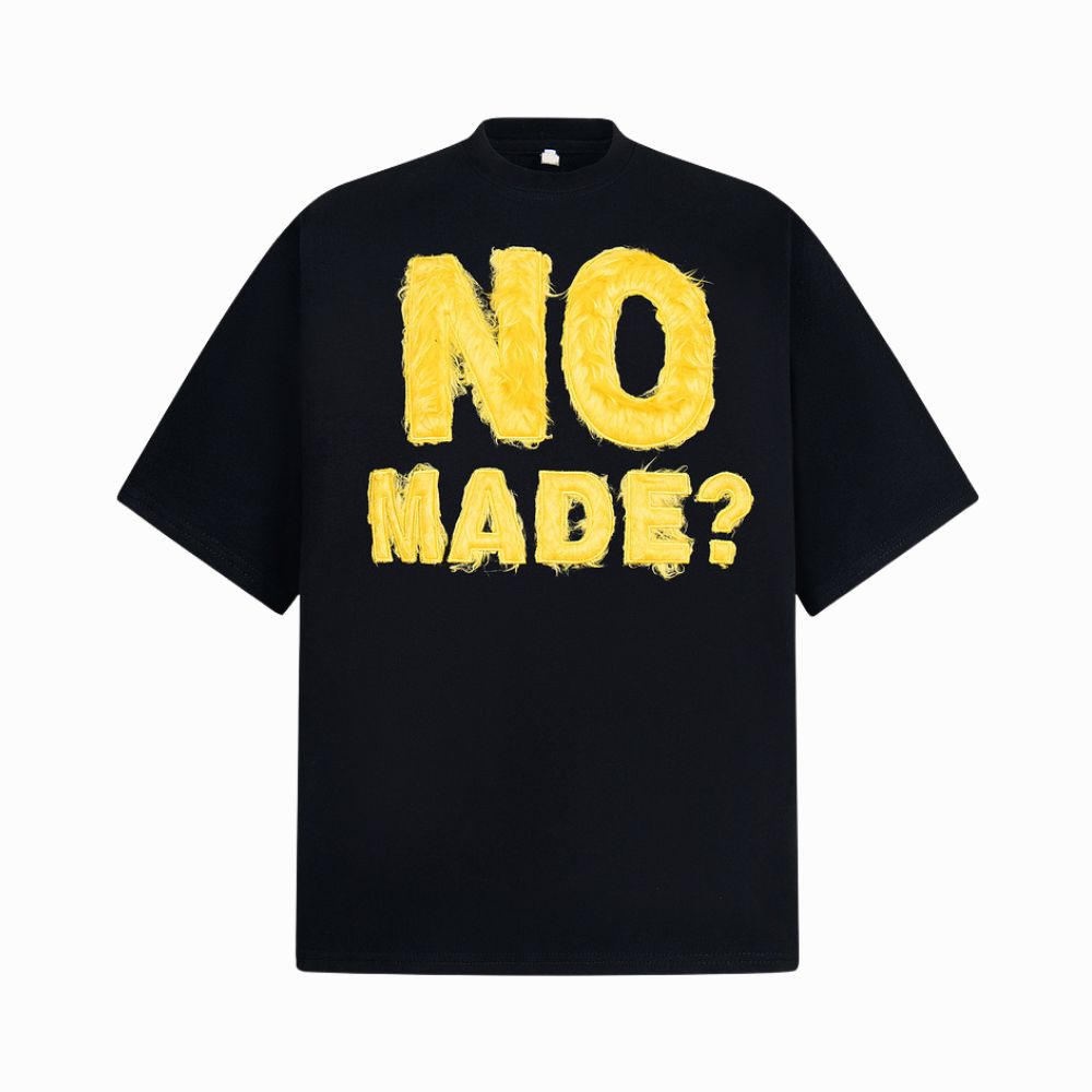 Black t-shirt with yellow text 'NO MADE?' on a white background