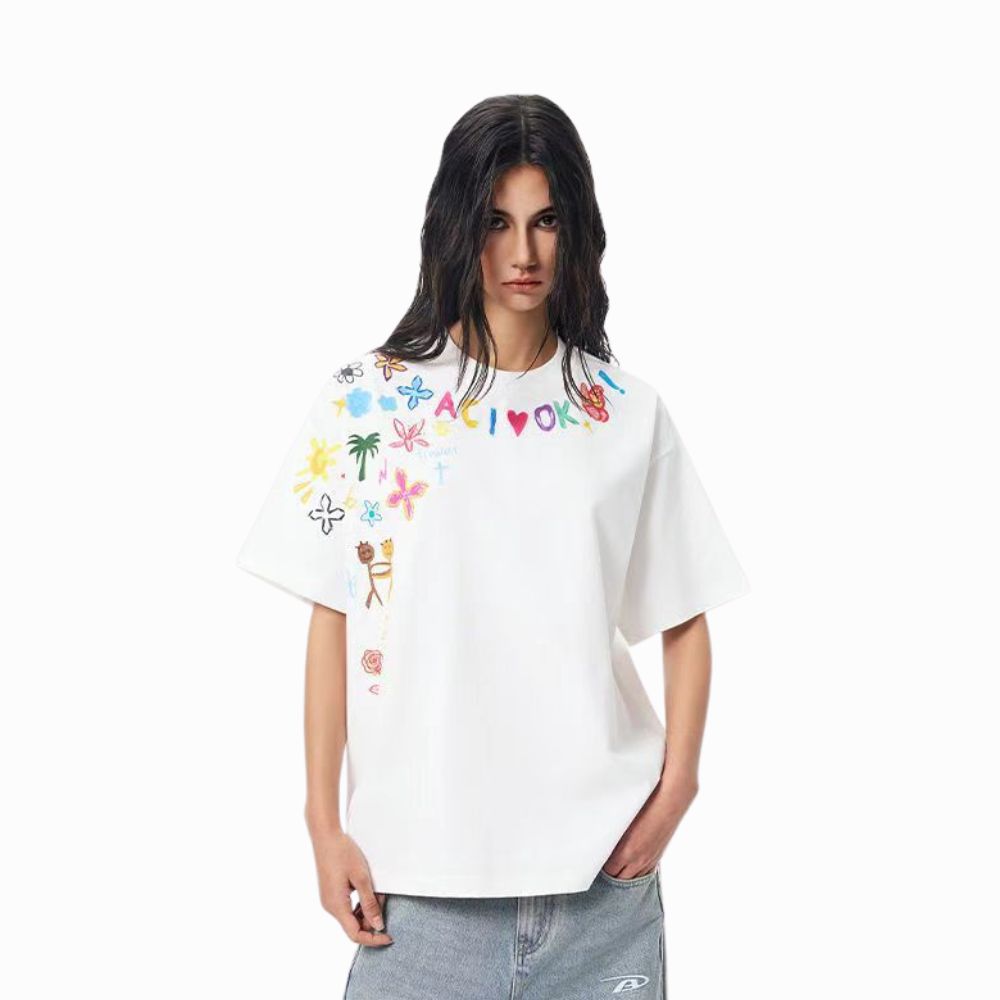 Person wearing a white t-shirt with colorful graphics and text on a white background