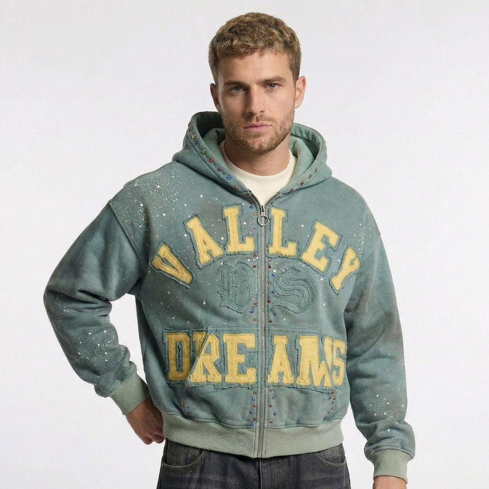 Man wearing a hoodie with 'Valley Dreams' text on a white background