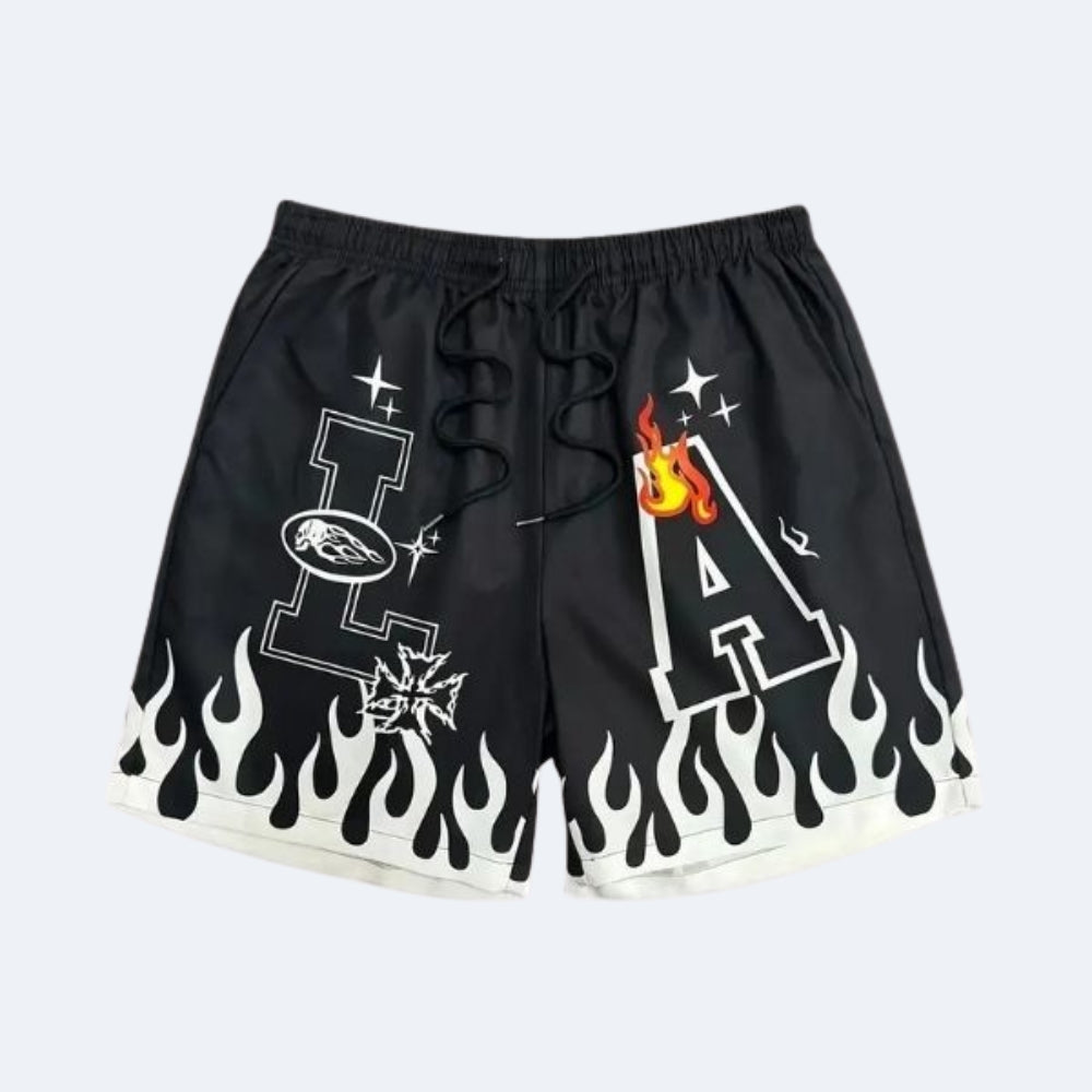Black. Black athletic shorts with white flame graphics along the hem, featuring a large white letter A with a flame.